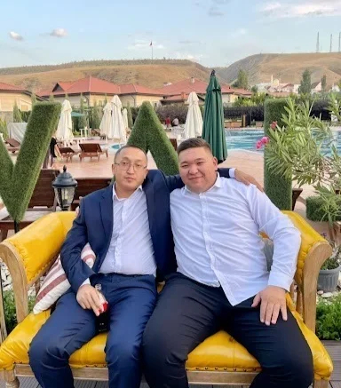Syrgakbek Atyshov (left) embraces Eskat Nurkozhoev, the nephew of the President of Kyrgyzstan. Source: Atyshov’s social media